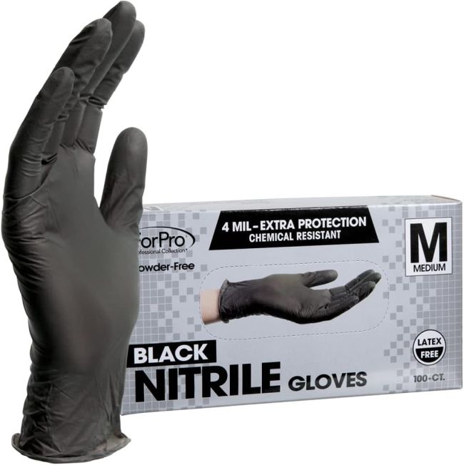 Black nitrile glove next to a box of more gloves