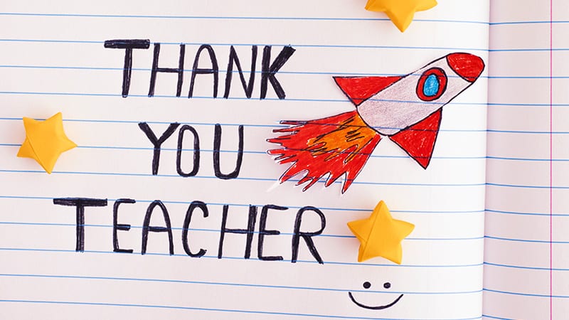 Thank you teacher written on a piece of paper.